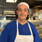 A New York pizzeria owner saw a woman eating from his rubbish bin, then he put up a handwritten note offering free pizza to anyone who was hungry