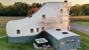 In 1949, Pennsylvania shoe salesman Mahlon Haines built a 25-foot-tall work-boot house for $26,000; after falling into ruin, his granddaughter restored it and guests can now sleep inside