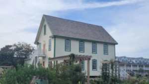 In 1901, Ocracoke opened a two-story island inn; after a $750,000 community purchase, hurricane delays and eight years of restoration, the raised building has passed final inspection as a public cultural center