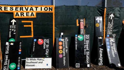 New Yorkers queued for hours to buy discarded subway hardware at an MTA sale where old signs cost $500 to over $1,000, orange seats sold for about $900 and Spike Lee picked up a Penn Station sign